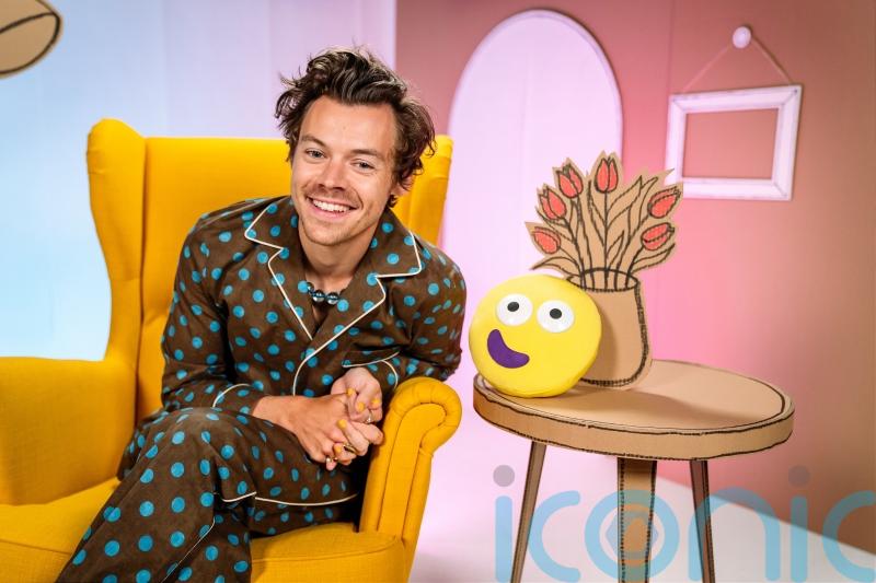 Harry Styles wears spotted pyjamas to read his CBeebies Bedtime Story