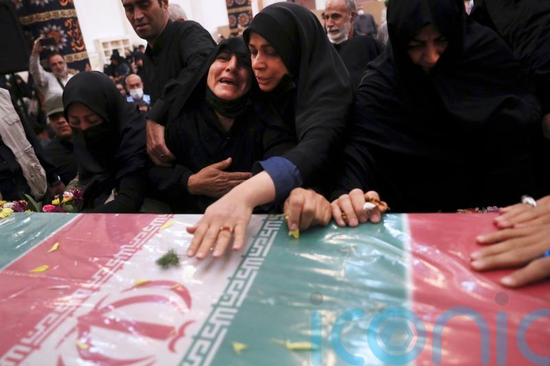 Thousands attend funeral for Revolutionary Guard colonel shot dead in Iran