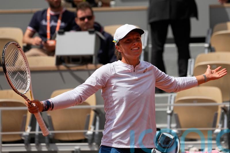 Iga Swiatek survives second-set scare to progress in French Open