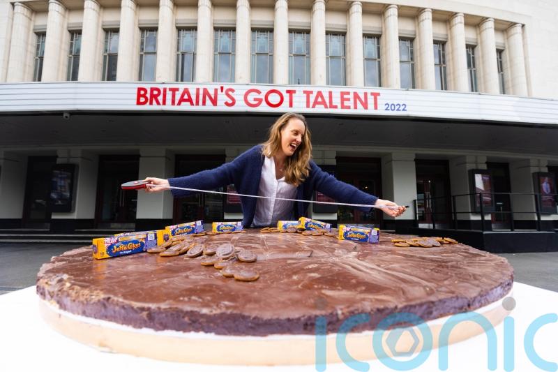 Former Bake Off champion unveils world’s largest Jaffa Cake