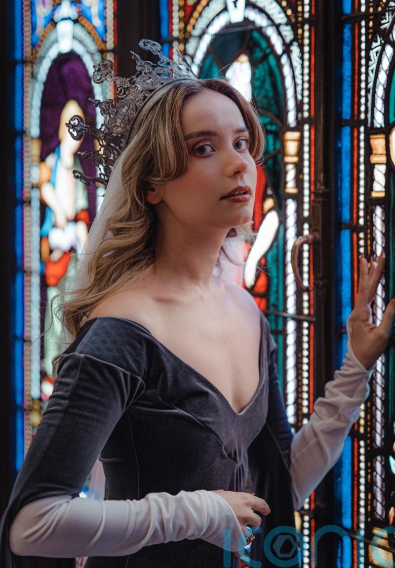 Intern fulfils regal childhood dreams after redundancy by becoming a medieval Queen on TikTok teaming her ballgowns with one of 250 tiaras