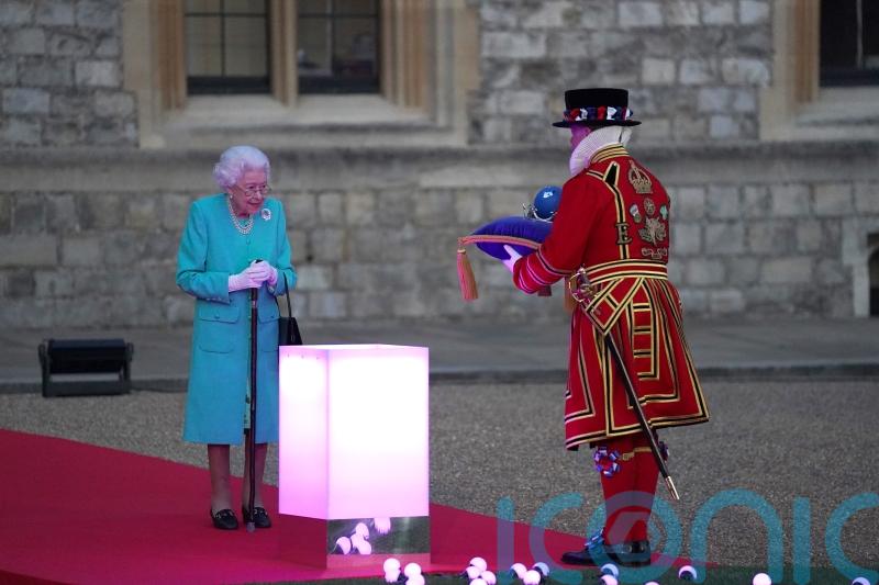 Delighted Queen leads first day of Jubilee at beacon lighting and on balcony
