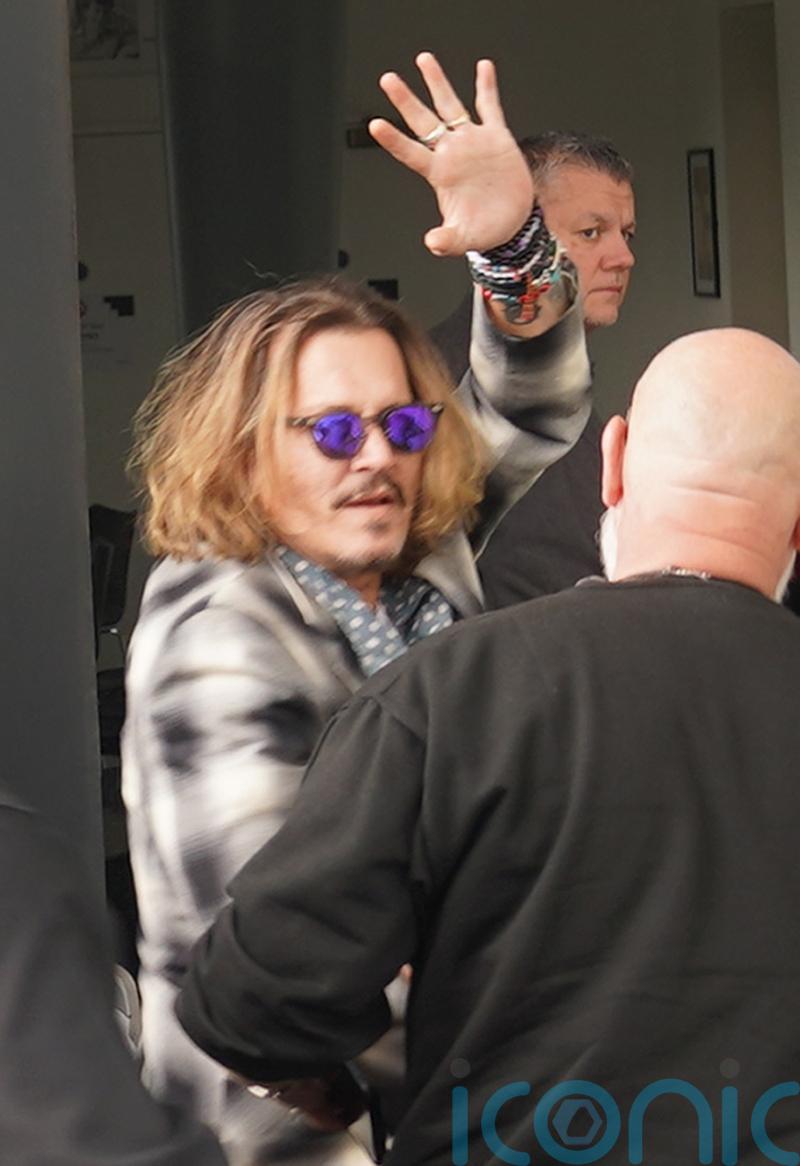 Johnny Depp cuddles orphaned badgers as he continues UK tour with Jeff Beck