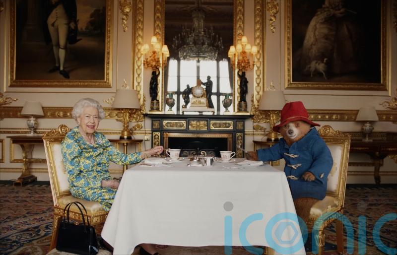 Queen reveals marmalade sandwiches in handbag to Paddington in comic sketch
