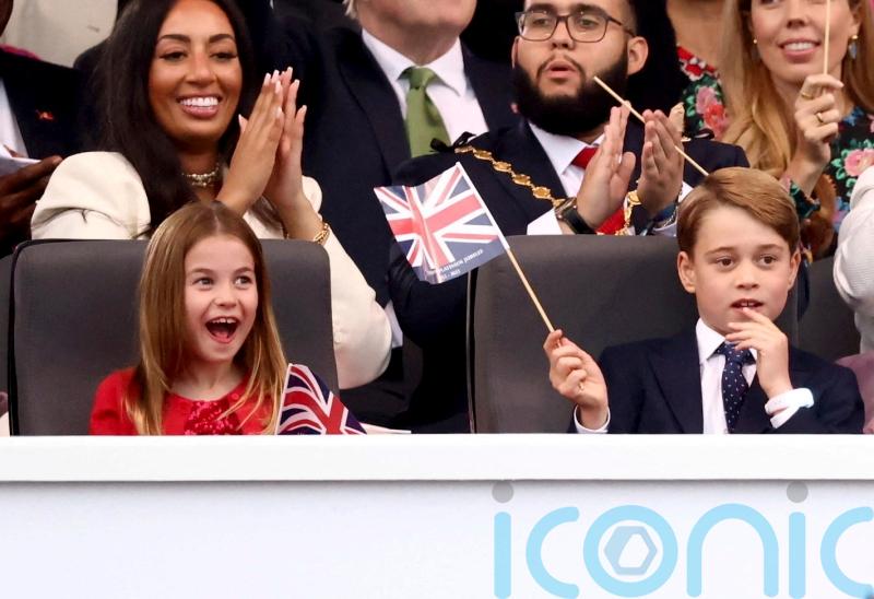 Sing-song for royals as George and Charlotte join flag-waving Windsors