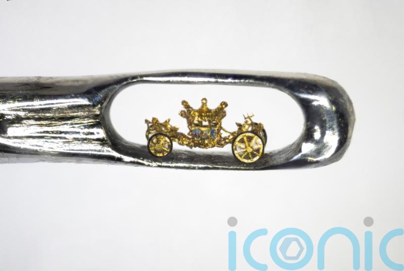 Sculptor creates tiny royal coach in the eye of a needle as Jubilee tribute