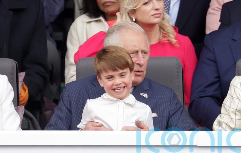 Louis shares cuddle with Charles as he sits on his grandpa’s lap