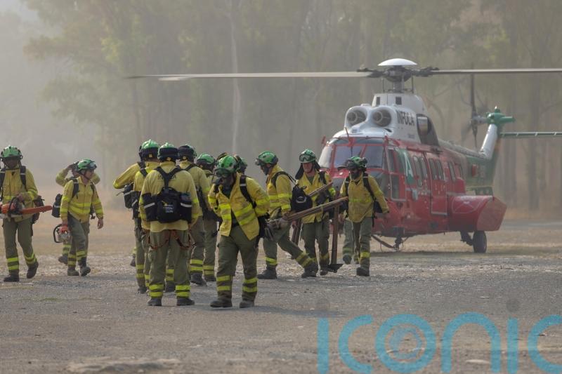Spain evacuates 2,000 people as crews race to check wildfire