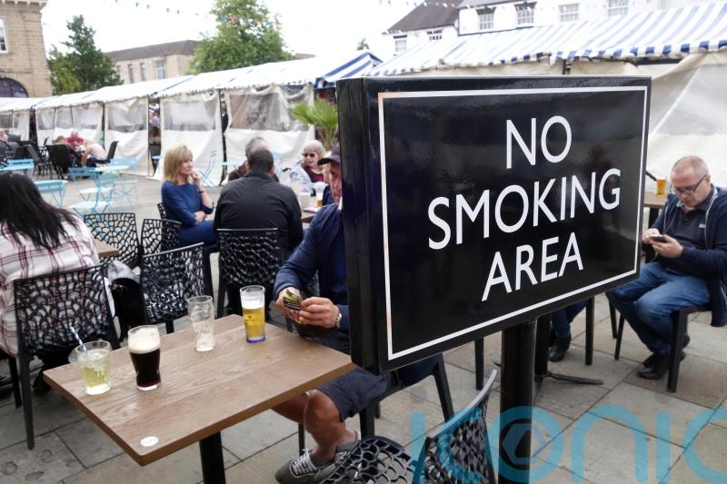 Ban smoking outside pubs and on beaches, major report suggests