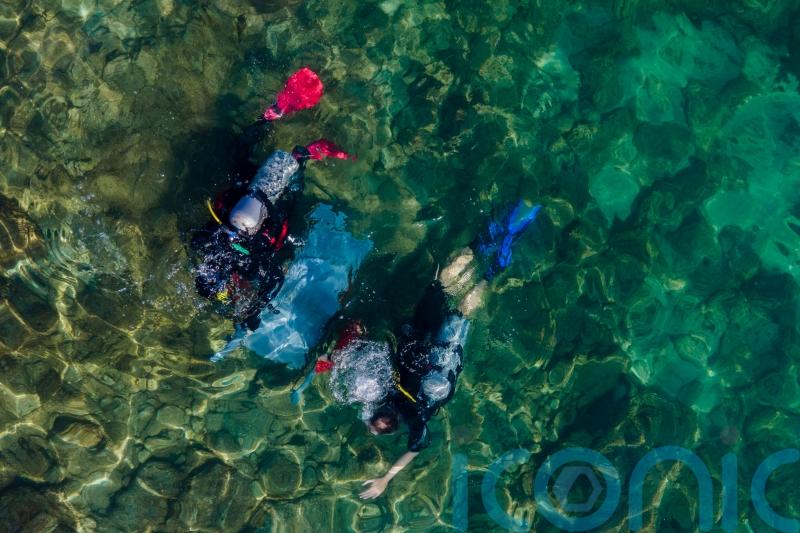 Israeli divers haul rubbish from ancient site for Oceans Day