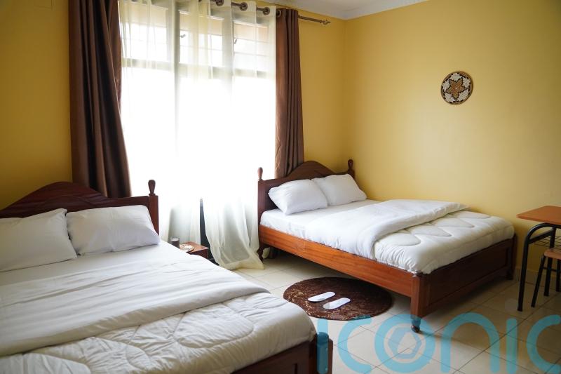 What are the plans to fly migrants seeking asylum in the UK to Rwanda?