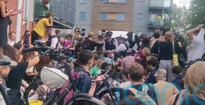 Man arrested for immigration offences released on bail as protesters block van