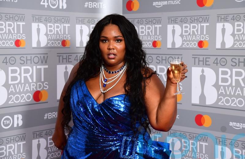 Lizzo announces new version of song Grrrls following backlash over ableist lyric