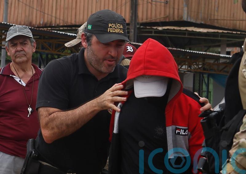 Brazilian police take suspect to search area for missing Briton