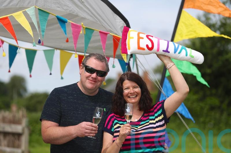 Family at Glastonbury for first time as lottery millionaires – in an old caravan