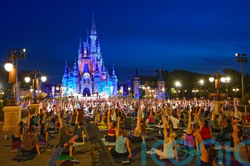 Disney workers strike a pose on International Yoga Day