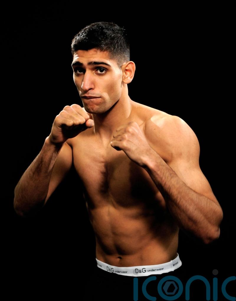 Three men charged after boxer Amir Khan ‘robbed at gunpoint’