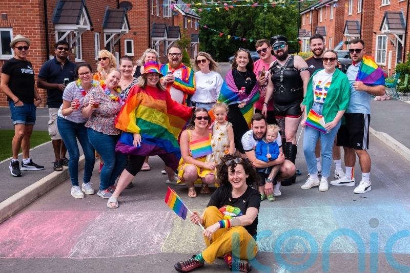 Neighbours join to march 80 metres in one of world’s shortest Pride parades