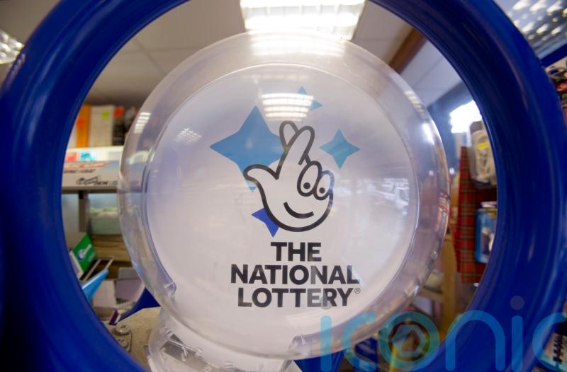 National Lottery firm sees signs of player &lsquo;belt-tightening&rsquo; in cost crisis