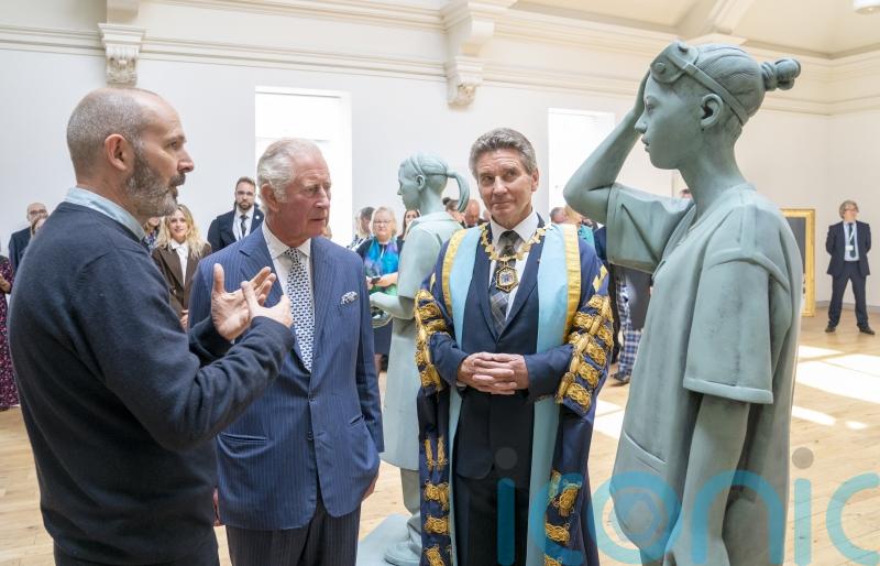 Charles views life-size sculptures honouring NHS staff for work during pandemic