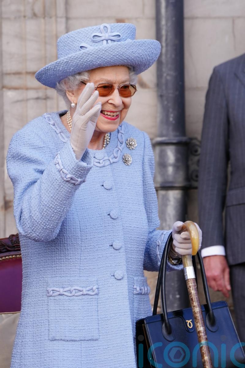 Smiling Queen takes part in third event during royal week in Scotland