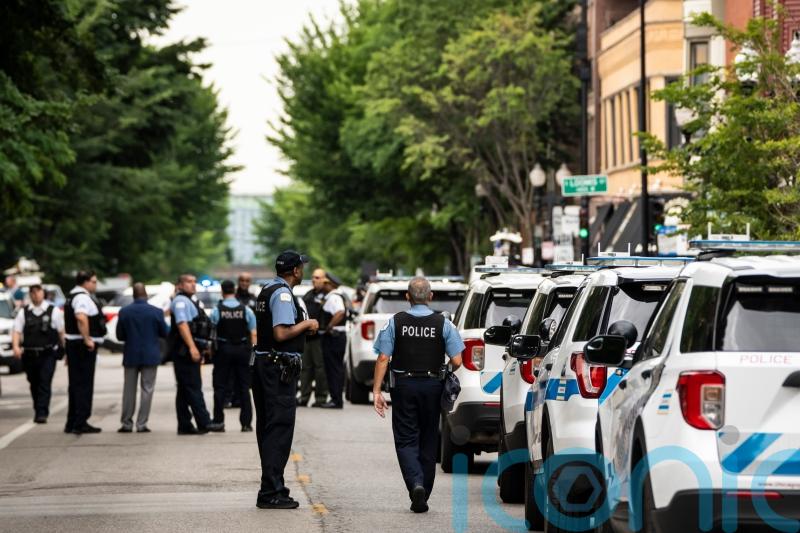 Gunman kills two people and wounds three police officers in shootout