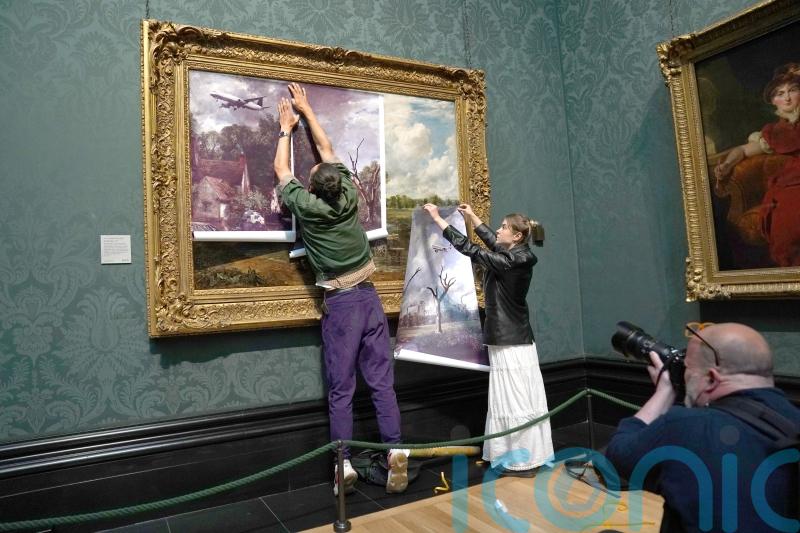 Climate change protesters glue themselves to frame of Constable’s Hay Wain