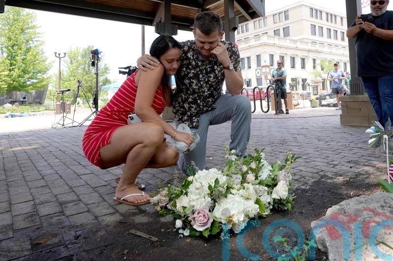Parade shooting suspect charged with seven counts of murder