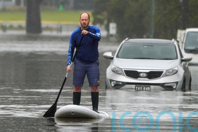 Homes of 85,000 people still at risk as rain eases around Sydney