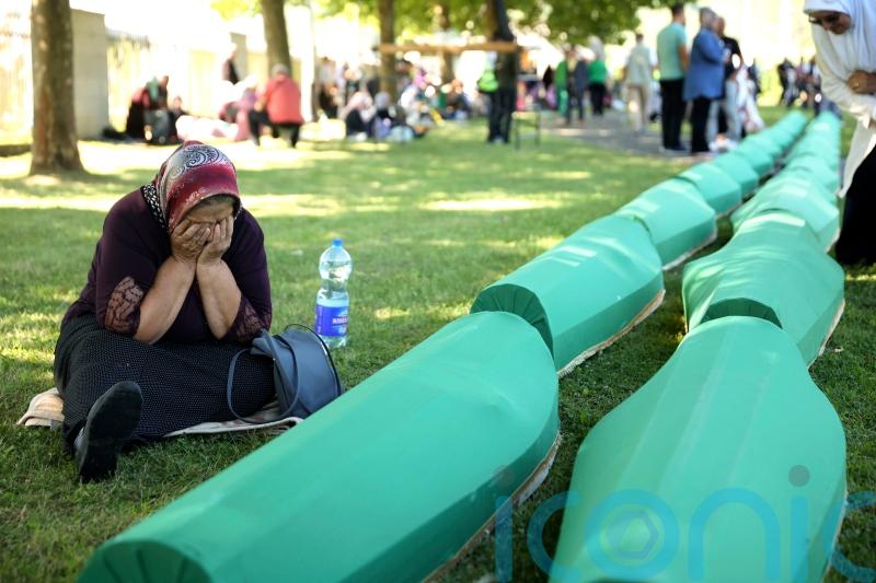 Thousands gather to mark Srebrenica massacre and bury victims