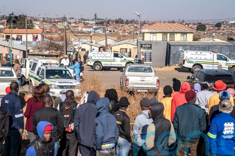 South Africa shocked by bar shootings that killed 21 as police hunt suspects