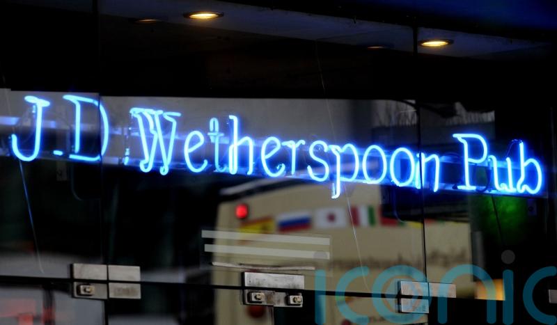 Wetherspoon warns over annual losses due to hiked wages and slow sales recovery