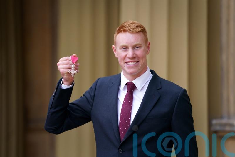 I’ve had worse Thursdays, jokes Olympic swimmer Tom Dean as he collects MBE