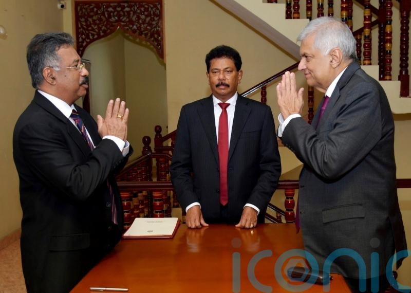 Sri Lanka’s PM sworn in as interim president after Rajapaksa resigns