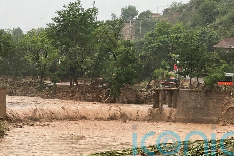 At least 12 dead as thousands evacuated amid flash floods in China