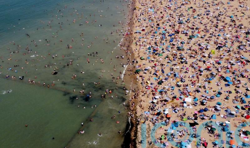 In Pictures: Thousands head to beaches as health boss warns of &lsquo;ferocious heat&rsquo;