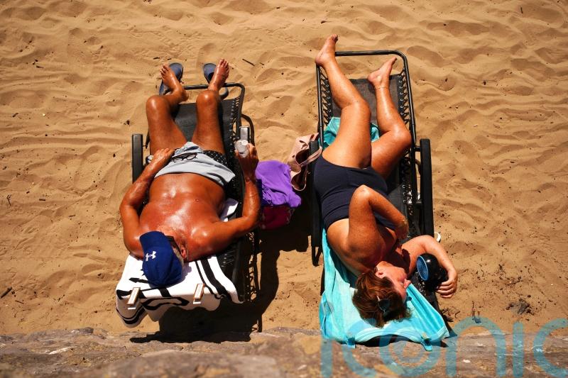 Wales ‘records hottest day on record’ as temperatures hit 37.1C