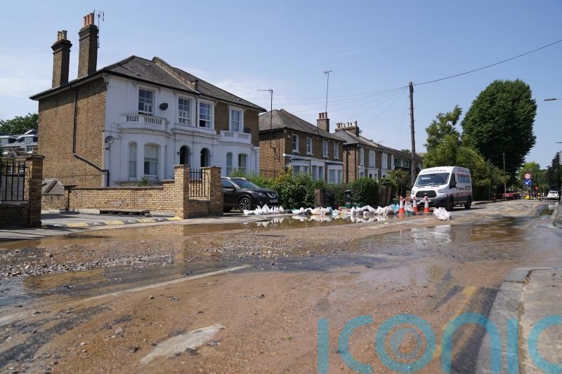 Burst water main floods London streets as temperatures soar