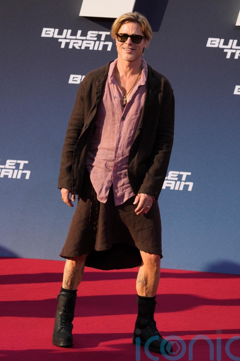 Brad Pitt swaps trousers for a skirt at Berlin red carpet event