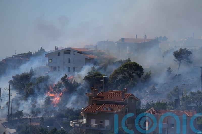 Fires threaten Athens’ hillside suburbs for second day