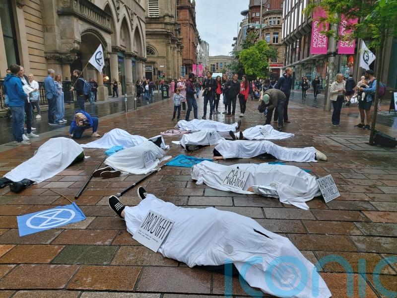 Climate activists stage ‘die-in’ protest in Glasgow following record temperatures