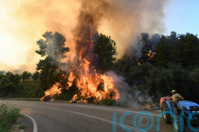 Six Greek villages evacuated as wildfire burns near Ancient Olympia