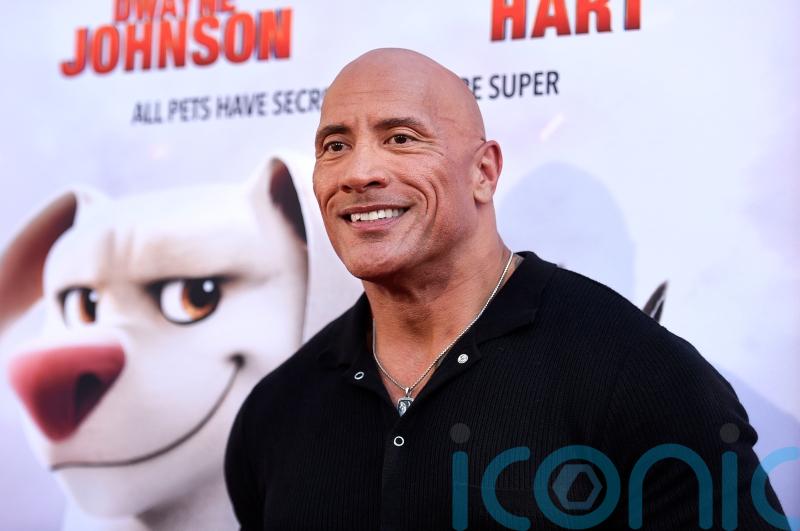 Dwayne Johnson surprises family of fans with new puppy at Super-Pets screening