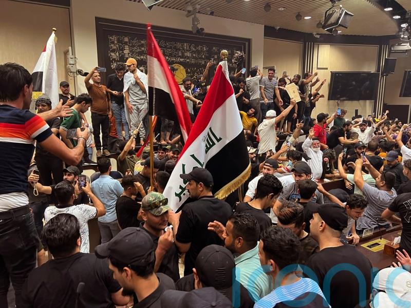 Followers of cleric enter Iraqi parliament in show of force