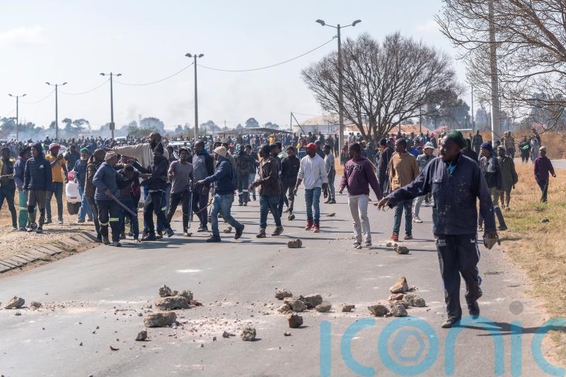 Clashes in South Africa as illegal miners targeted after alleged gang rapes