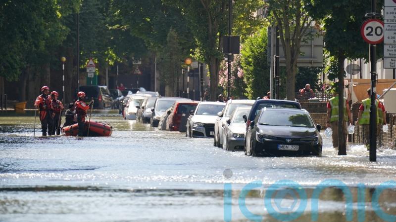 Roads closed as burst water main causes four-foot deep flooding