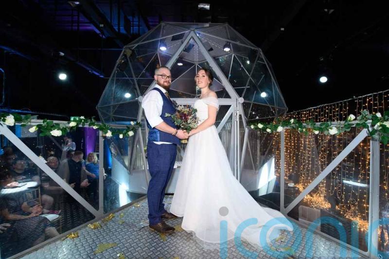 Mum-of-two whose proposal came on a scavenger hunt has “game show-style” wedding at Manchester’s Crystal Maze Live Experience dome
