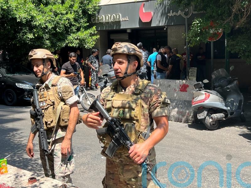 Armed man demanding savings holds Beirut bank staff hostage