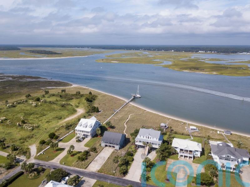 Umbrella swept by wind kills woman at South Carolina beach