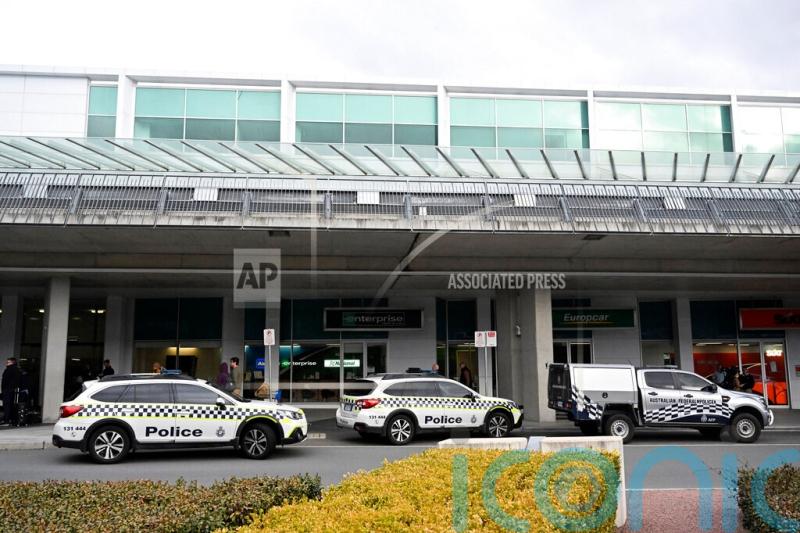 Australian man charged after shooting at windows inside airport
